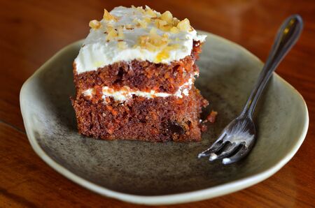 Piece of cake on wooden table