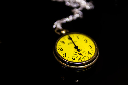 Vintage yellow watch, symbols of time with copy space
