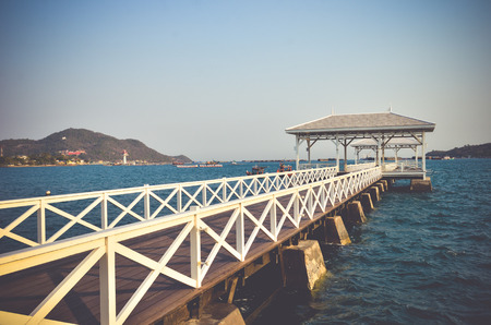 Woolden bridge  in the port at Koh Sichang, Thailand, Toned vintage effect.の写真素材