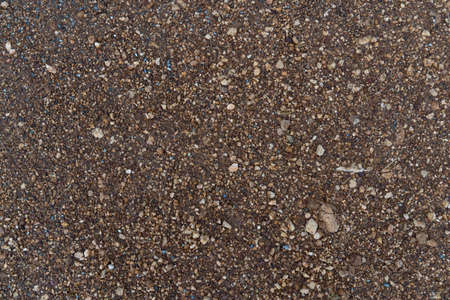 Background and textured of above view gravel road and gravel in red-brown tones.