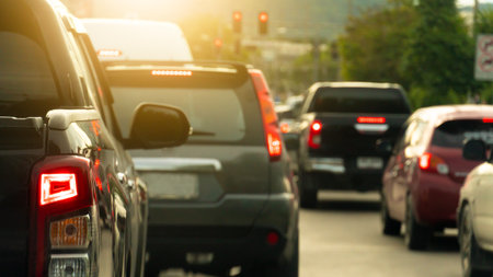 Rear side of pickup car black color with turn on brake light on asphalt roads. During rush hours for...