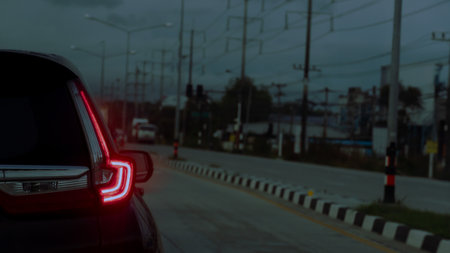 Rear side of cars on the asphalt road. Stop and open light brake. Environment and evening light....
