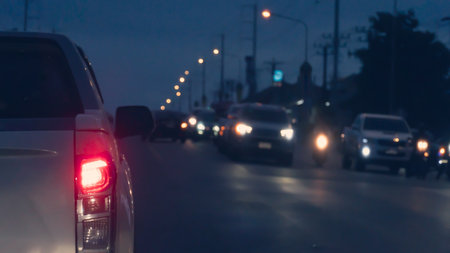Abstract rear side of car with open trail light. stop on the road by traffic red light control. with...