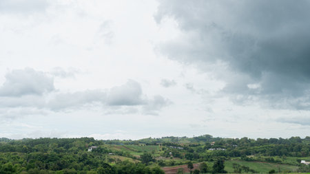 Landscap view of houses are arranged in a perfect harmony between the hills and trees. at Khao Kho Phet Cha Bun Thailand. Under of the sky and clouds.の写真素材