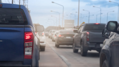 Close up on trail light of pickup car blue color. Many cars are parked in a row. Common sense on city roads during rush hour in Thailand.の写真素材