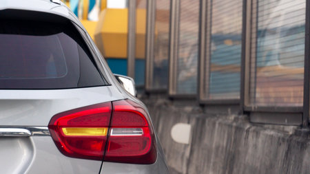 Rear side of luxury grey car with turn on right signal. Side car have protection road damage by cement and protection sound by glass.の写真素材