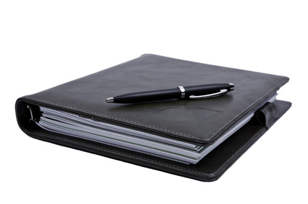 book and pen isolated on white backgroundの写真素材