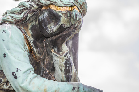 Portrait sculpture of a female figure made of metal with schwarzgrner patina.の写真素材