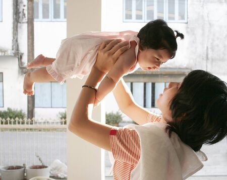 The Baby happy and nice with her Mum の写真素材