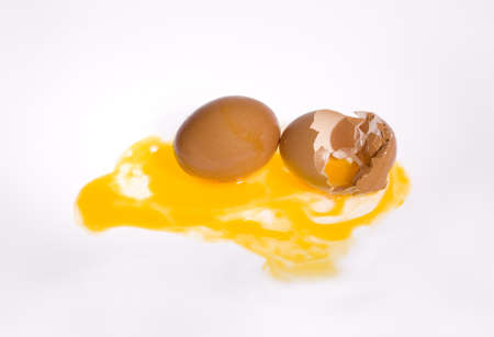 Hen Egg lay on Isolate Background   One is Broken Eggshell  Show Yellow York の写真素材