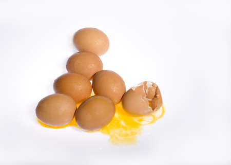 Hen Egg lay on Isolate Background   One is Broken Eggshell  Show Yellow York の写真素材