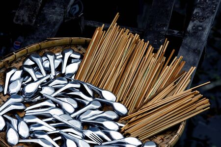 Reflection from Stainless Spoon and chopstick made from Bamboo の写真素材