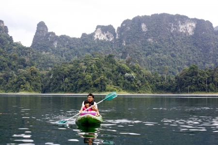 Family , Dad , Mum Daugther, son are Enjoy with Swimming  in Lake at Holidayの写真素材