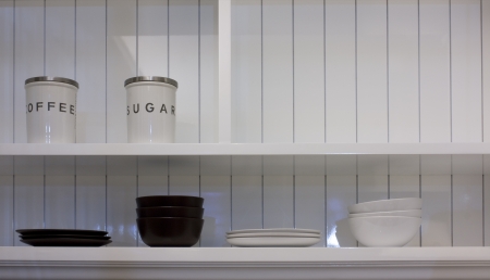 The Modern  White Side Board and bottle, bowl,plate , in the kitchenの写真素材