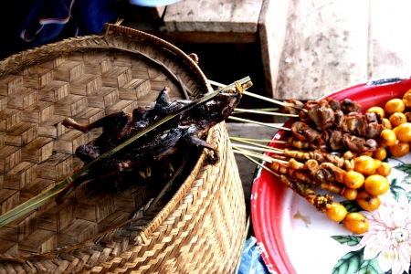People In Lao Market sell and buy Fruit, Vegetable, Meat from The Farm and Wild Animalの写真素材