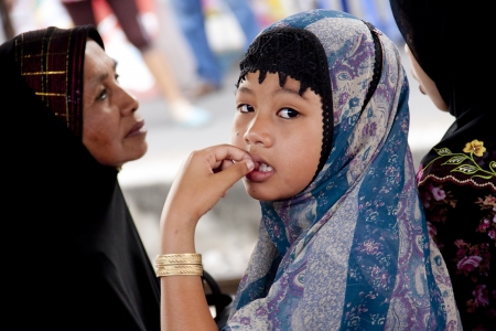 YALA,THAILAND - APRILL 2013: Young Muslim Girl and Her Mother at South of Thailand on Aprill 19,2013. Yala Province  is Terrorism area of Three Province in South of Thailand.のeditorial素材