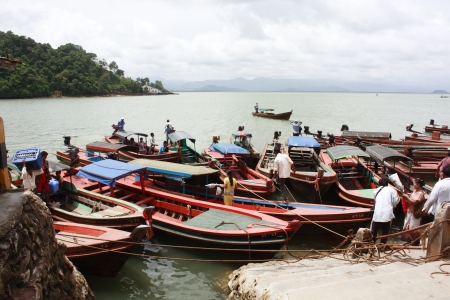 Tourist get out of a boat at Victoria Point Harbour For transport and tourist to Ranong Province Thailand.のeditorial素材