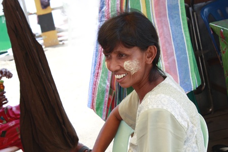 Lifestyle of Myanmar People still wear sarong and worship Buddhism,woman make up with Tanaka or Thanaka Powder.のeditorial素材