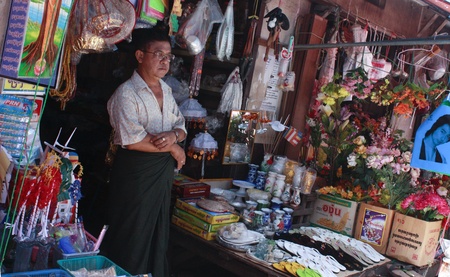 Lifestyle of Myanmar People. Old style Market or Grocery sell food, meat, fish, vegetable,canned food,tobacco leaf, garment, gold, gem, electronic, computer, mobile and etc.のeditorial素材