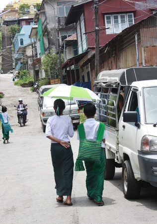 Student wear sarong go to school.Lifestyle of Myanmar People still wear sarong and worship Buddhism.のeditorial素材