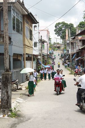 Student wear sarong go to school.Lifestyle of Myanmar People still wear sarong and worship Buddhism.のeditorial素材