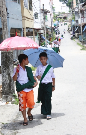 Student wear sarong go to school.Lifestyle of Myanmar People still wear sarong and worship Buddhism.のeditorial素材