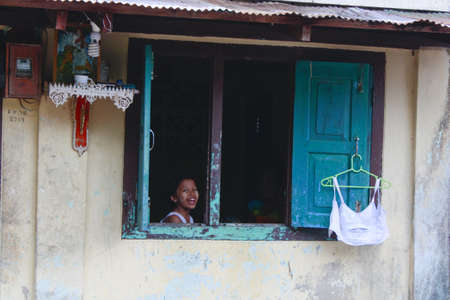 Lifestyle of Myanmar People still wear sarong and worship Buddhism,woman make up with Tanaka or Thanaka Powder.のeditorial素材