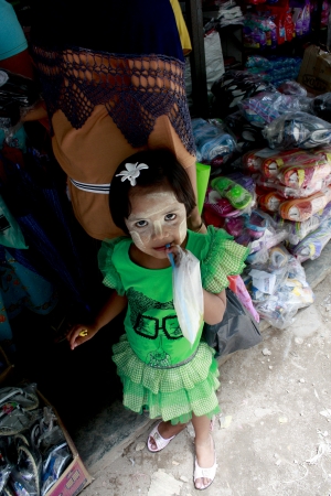 Lifestyle of Myanmar People still wear sarong and worship Buddhism,woman make up with Tanaka or Thanaka Powder.のeditorial素材