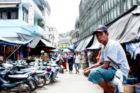 Lifestyle of Myanmar People still wear sarong and worship Buddhism,woman make up with Tanaka or Thanaka Powder.のeditorial素材