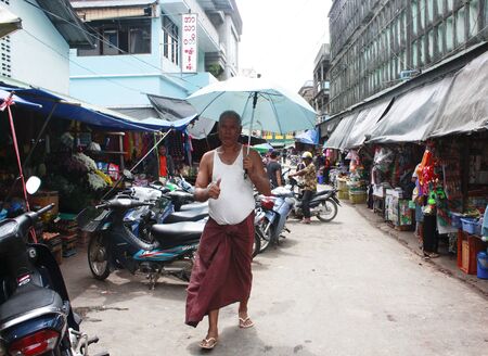 Lifestyle of Myanmar People still wear sarong and worship Buddhism,woman make up with Tanaka or Thanaka Powder.のeditorial素材