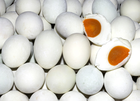 Duck eggs pile at supermarket .Top view shot. Eggshell are white and mix light red  or blue color.の写真素材