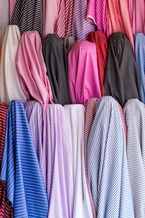 Display fabric rolls in fabric shop.Close up shot,more color and pattern fabric.の写真素材