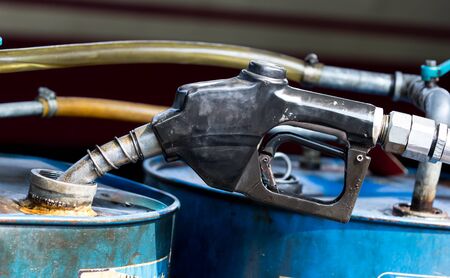 Fuel nozzle and oil tank in diesel train platform.の写真素材