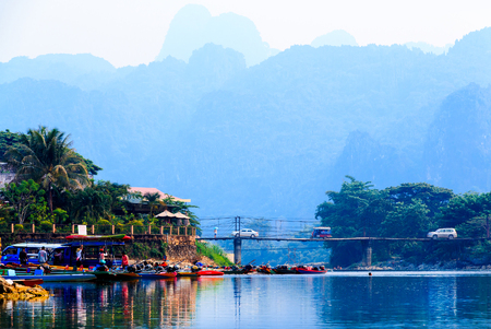 VANG VIENG, LAOS- 18 APRIL 2015 : Waterfront at end point rafting in Song River, Vang Vieng, Laos, Rafting with kayak and tubing are famous and do not miss enjoy.のeditorial素材