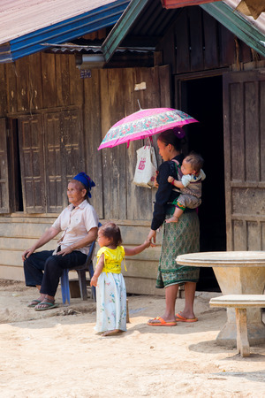 LUANG PRABANG, LAOS - APRIL 18, 2015: The simple  every day life of laos hill tribe in tribe village on the way from Luang Prabang to vientiane.のeditorial素材