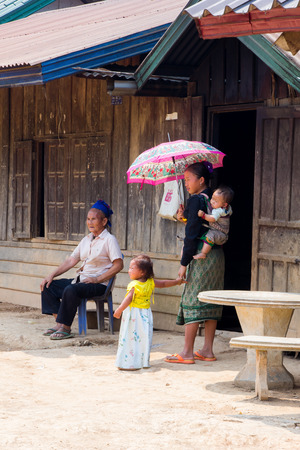 LUANG PRABANG, LAOS - APRIL 18, 2015: The simple  every day life of laos hill tribe in tribe village on the way from Luang Prabang to vientiane.のeditorial素材
