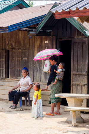 LUANG PRABANG, LAOS - APRIL 18, 2015: The simple  every day life of laos hill tribe in tribe village on the way from Luang Prabang to vientiane.のeditorial素材