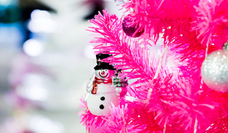 Snow man and pink christmas tree.for Merry Christmas and happy new Year card.の写真素材
