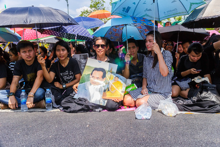 Bangkok, Thailand - October 14, 2016 :  Thai people are wearing black, white or dark coloured clothes during the mourning period for the funeral of His Majesty King Bhumibol Adulyadej.のeditorial素材