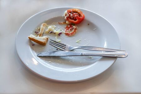 Some bread, cream and tomato in plate of American Breakfast.の写真素材