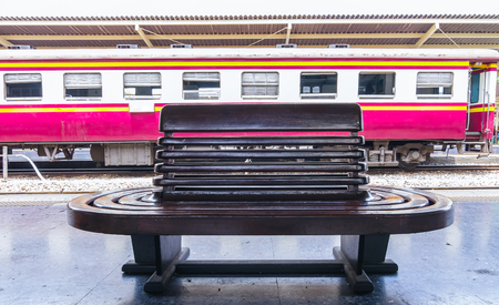 Vintage wooden bench at railway platform, The old style seating.の写真素材