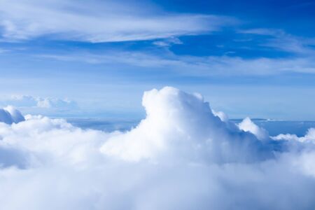 The bright blue sky with the excited white cloud shape.The photo shot with bird eye view from the...