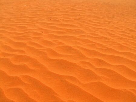 Red dunes with human traces in Mui Ne, Vietnamの写真素材