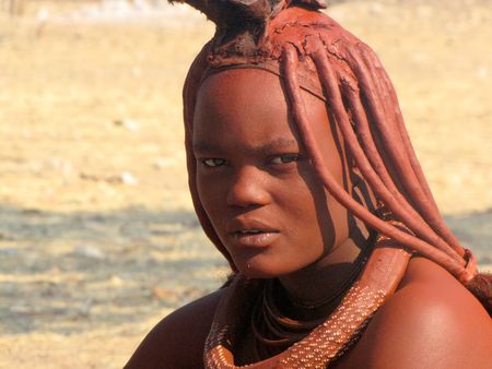 NAMIBIA, AUGUST 29, 2009: Young women in the village of Himba people near Opuwo in northern Namibia