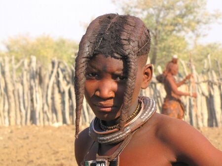 NAMIBIA, AUGUST 29, 2009: Young girl in the village of Himba people near Opuwo in northern Namibiaのeditorial素材