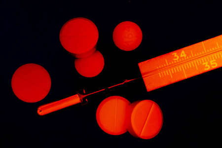 Pills and thermometer