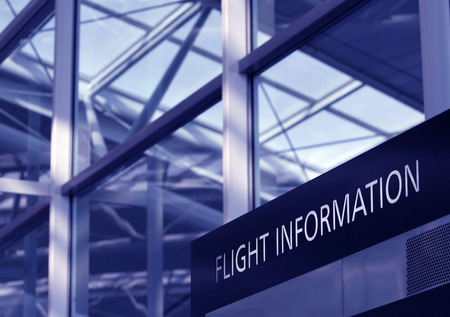 Flight Information Sign, Glass Facade Of An Airport Interior, Blue Toningの写真素材
