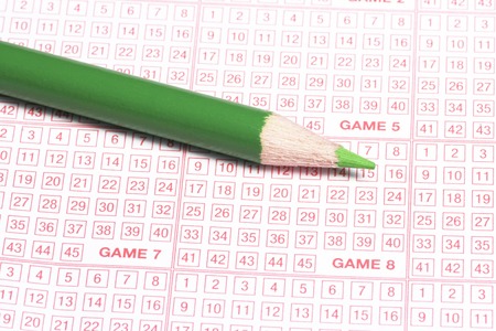 Close-Up Of Lottery Ticket And Green Pencilの写真素材