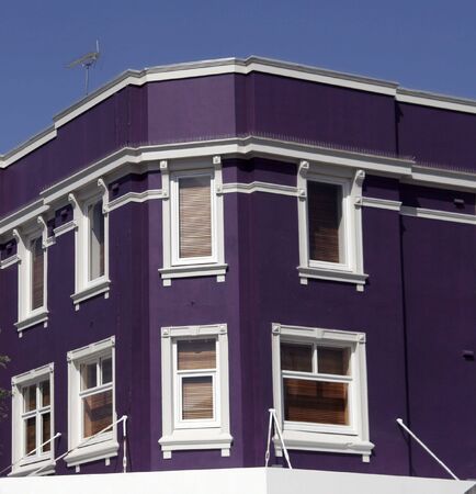 Purple, Violet Facade With White Windows, Urban Corner Buildingの写真素材