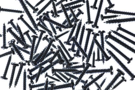 Many Spiral Metal Screws On A White Backgroundの写真素材
